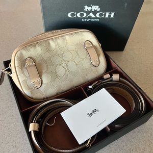 Small original Coach purse can be used as a hip purse or across the shoulder
